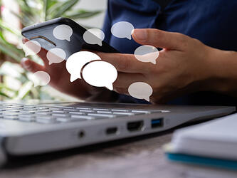 Speechbubbles, phone and laptop